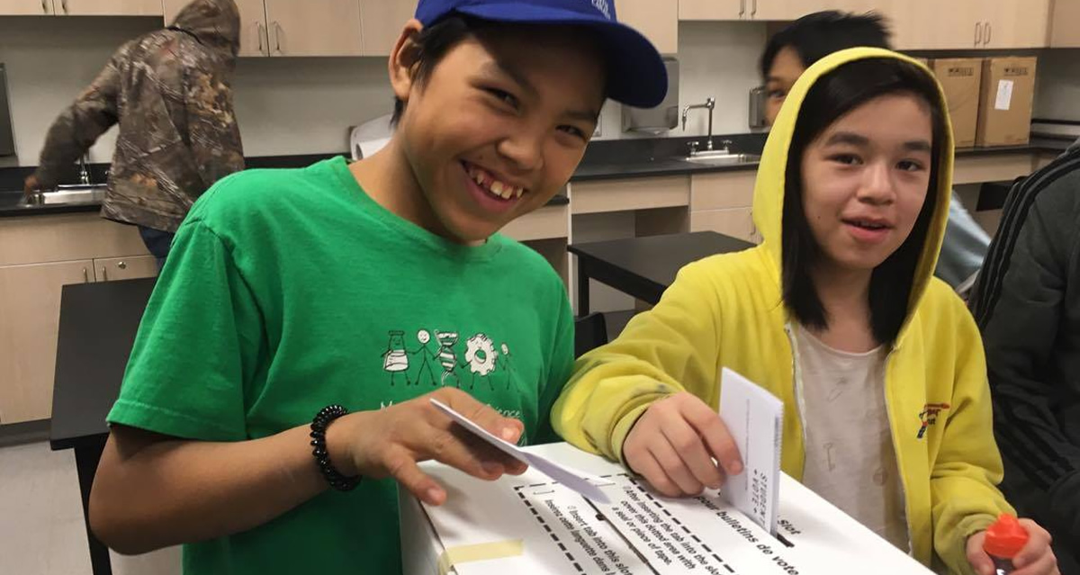 Students submitting their ballots